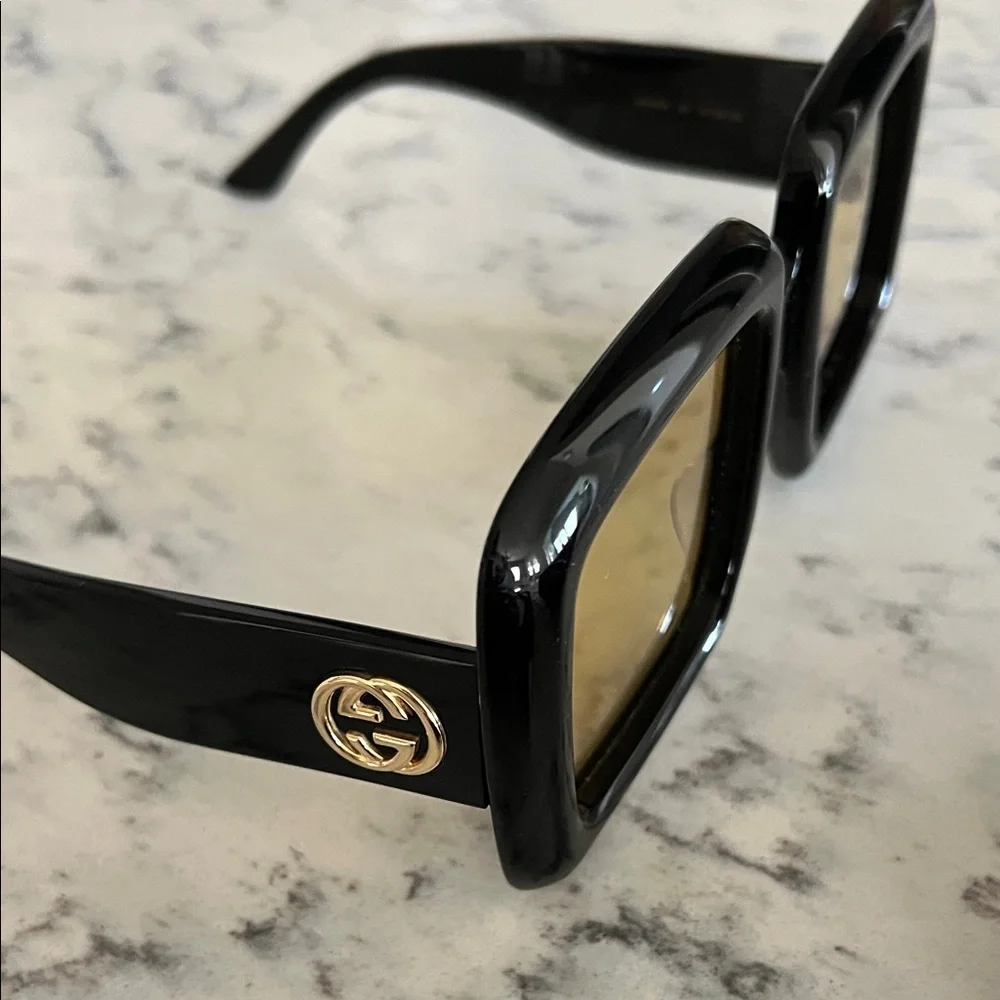 Gucci Women's Sunglasses with Black Frame and Gold Lenses - Picture 5 of 7